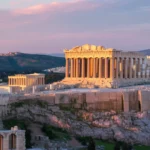 Aerial view of the Acropolis in Athens during sunset, highlighting the Parthenon.