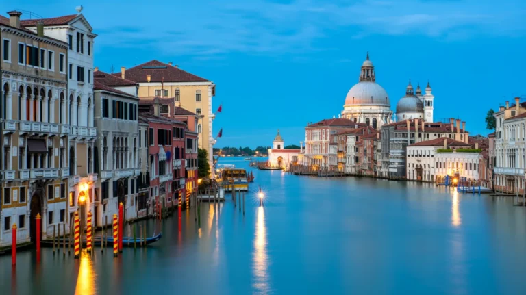 Scenic view of the Grand Canal in Venice at dusk, reflecting the city's charm